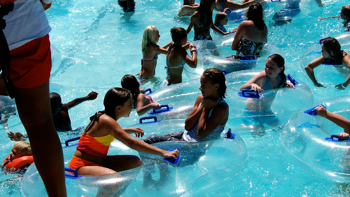 people in swimming pool during daytime